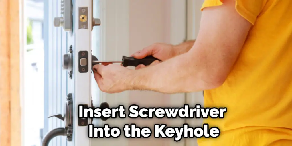 Insert Screwdriver Into the Keyhole
