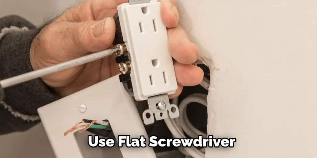 Use Flat Screwdriver