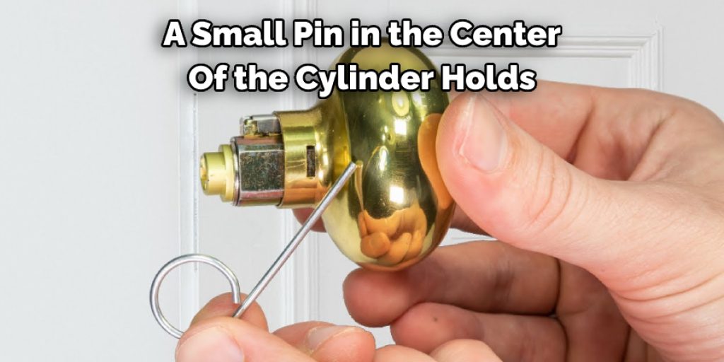 A Small Pin in the Center Of the Cylinder Holds