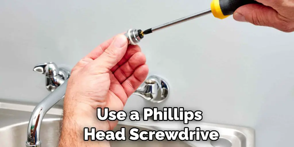 Use a Phillips Head Screwdrive