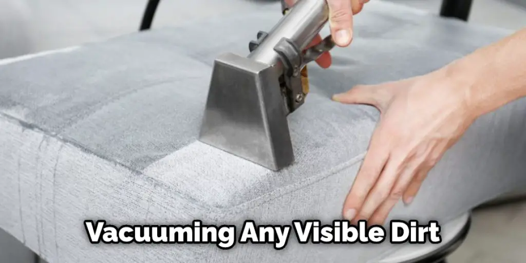 Vacuuming Any Visible Dirt