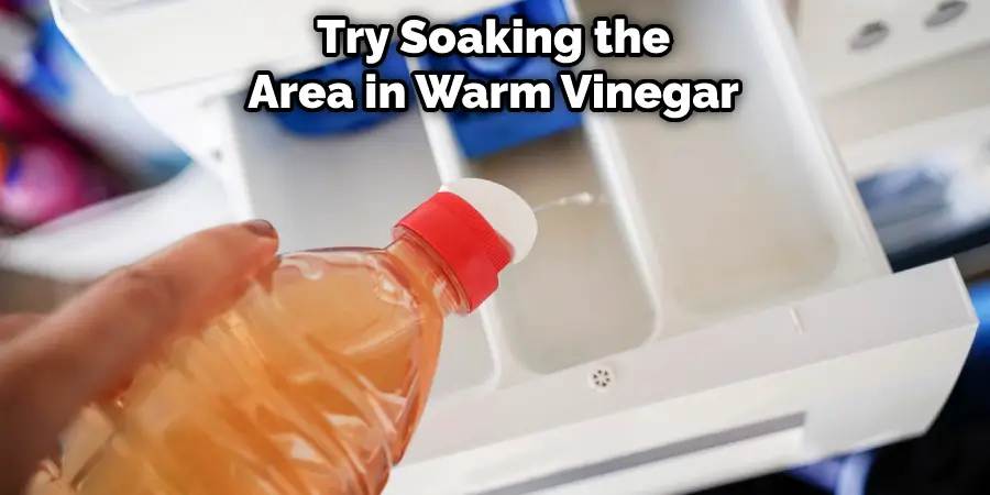 Try Soaking the Area in Warm Vinegar