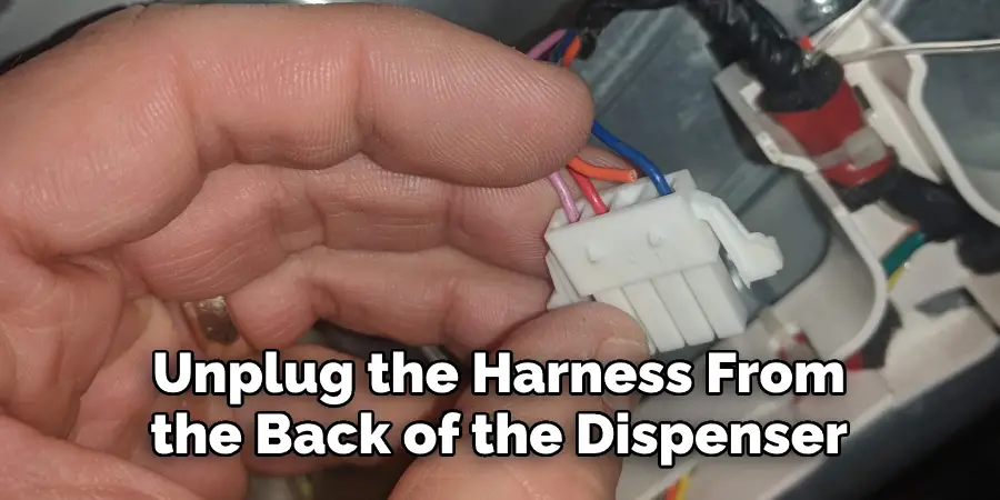 Unplug the Harness From the Back of the Dispenser