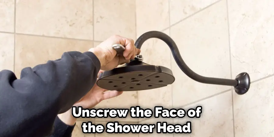 Unscrew the Face of the Shower Head