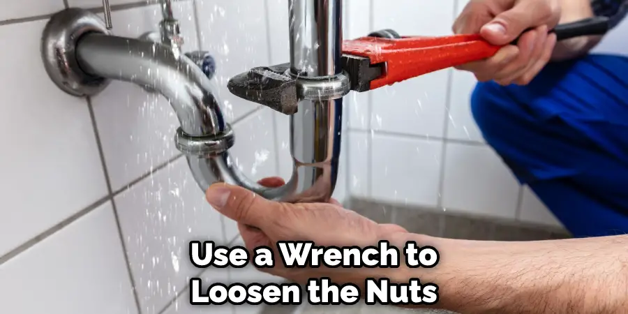Use a Wrench to Loosen the Nuts