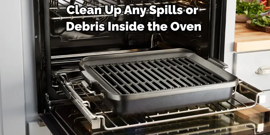 Clean Up Any Spills or Debris Inside the Oven