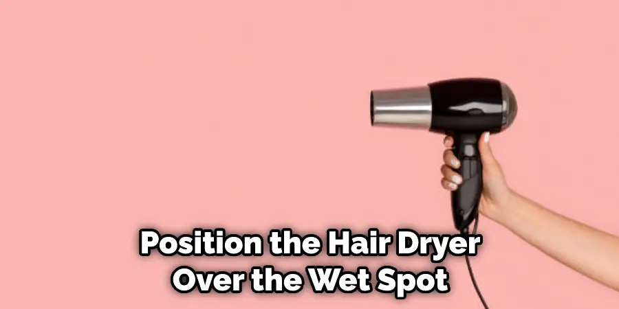 Position the Hair Dryer Over the Wet Spot
