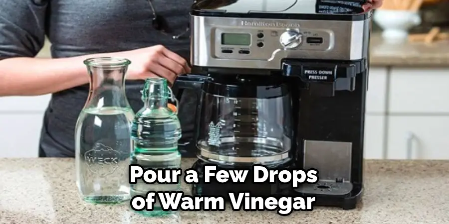 Pour a Few Drops of Warm Vinegar