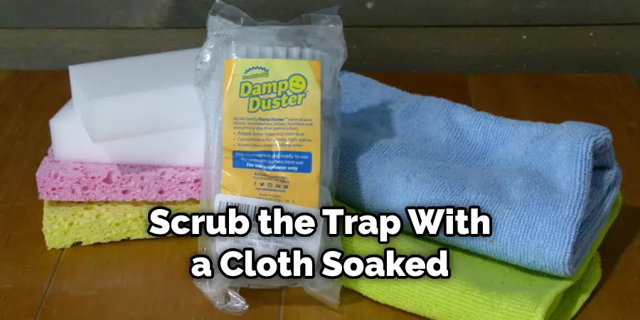 Scrub the Trap With a Cloth Soaked