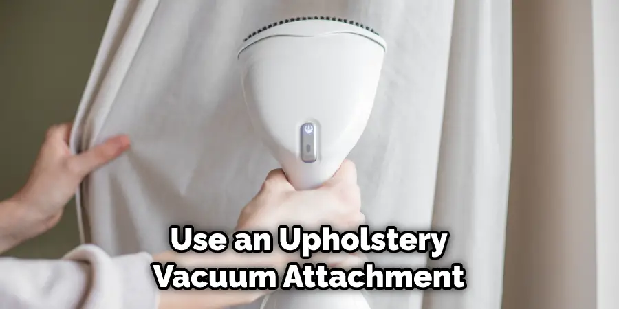 Use an Upholstery Vacuum Attachment