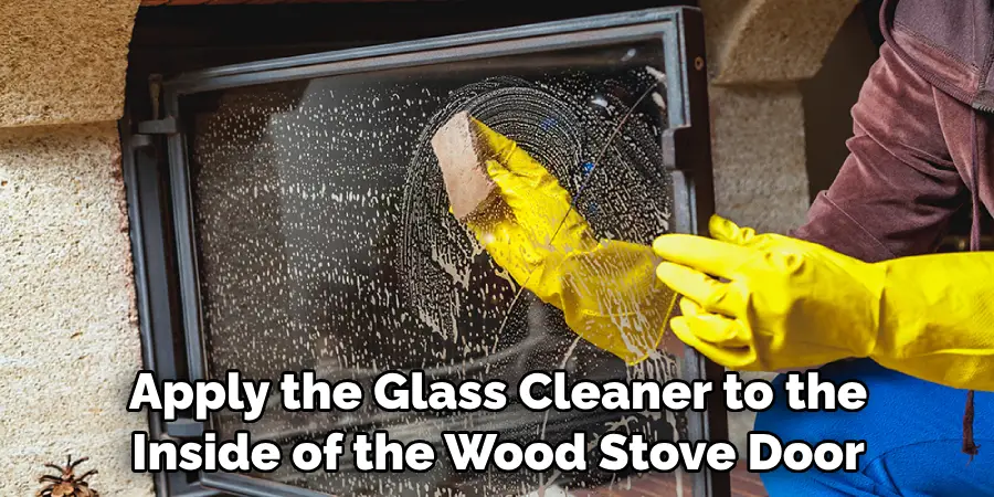 Apply the Glass Cleaner to the Inside of the Wood Stove Door