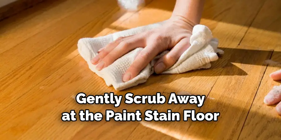 Gently Scrub Away at the Paint Stain Floor