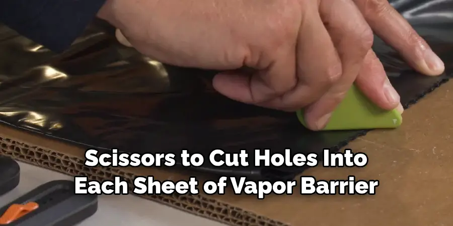 Scissors to Cut Holes Into Each Sheet of Vapor Barrier
