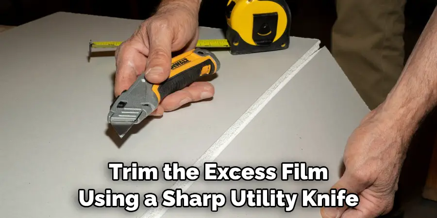 Trim the Excess Film Using a Sharp Utility Knife