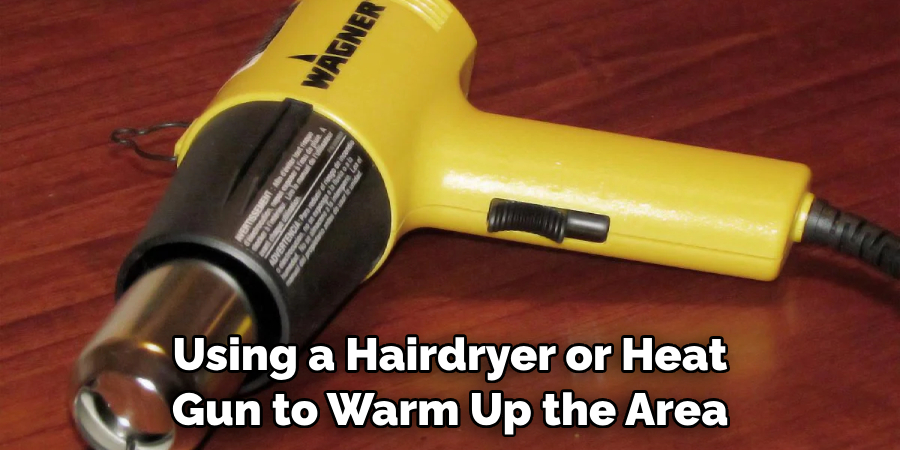 Using a Hairdryer or Heat Gun to Warm Up the Area