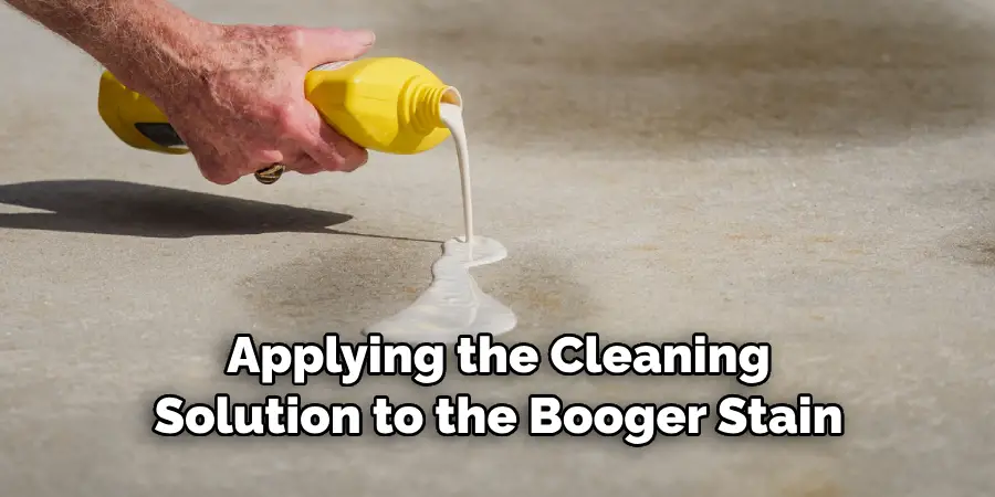 Applying the Cleaning Solution to the Booger Stain