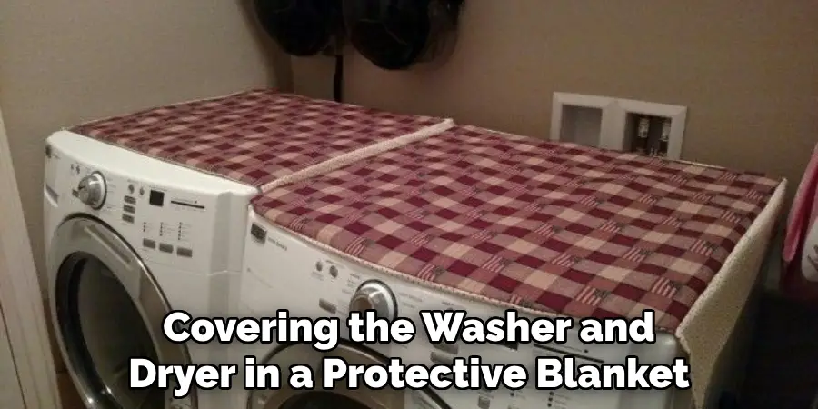 Covering the Washer and Dryer in a Protective Blanket