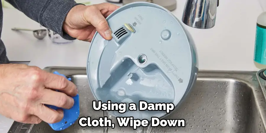 Using a Damp 
Cloth, Wipe Down 