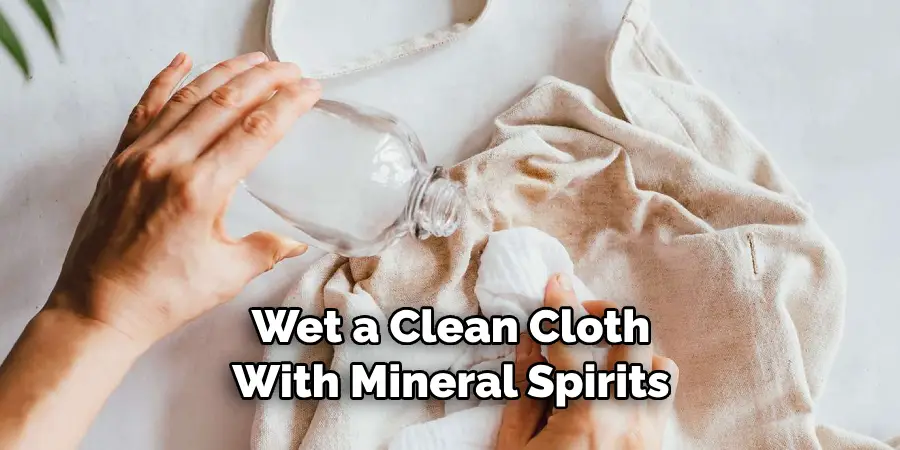 Wet a Clean Cloth With Mineral Spirits