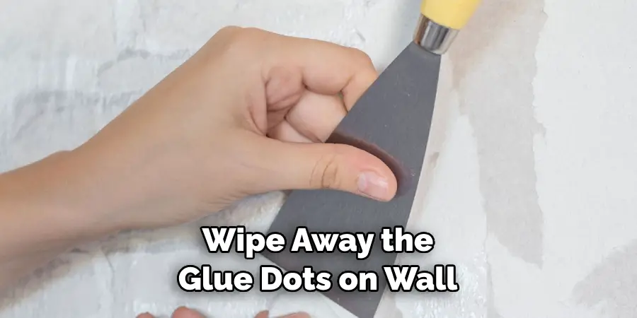 Wipe Away the Glue Dots on Wall