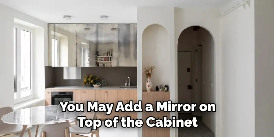 You May Add a Mirror on Top of the Cabinet