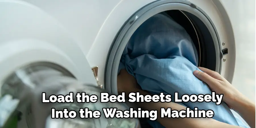 Load the Bed Sheets Loosely Into the Washing Machine