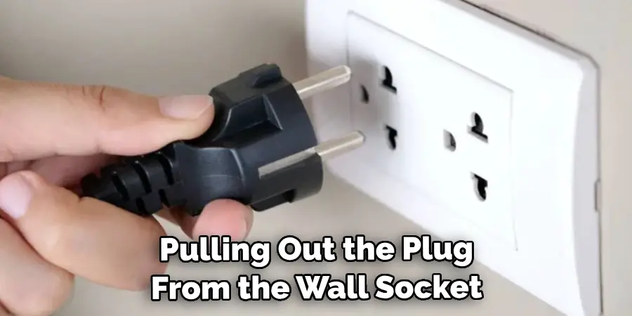 Pulling Out the Plug From the Wall Socket
