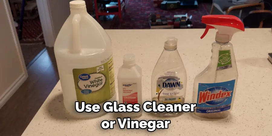 Use Glass Cleaner or Vinegar