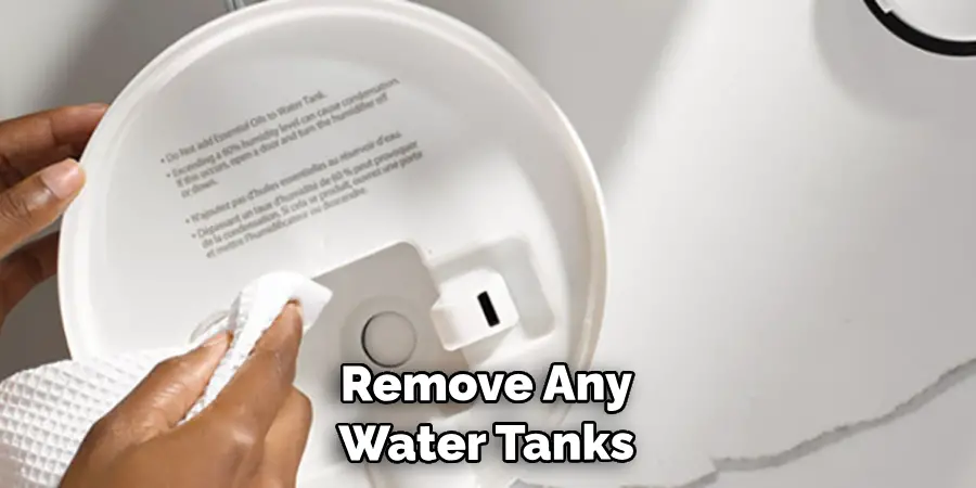 remove any water tanks or accessories