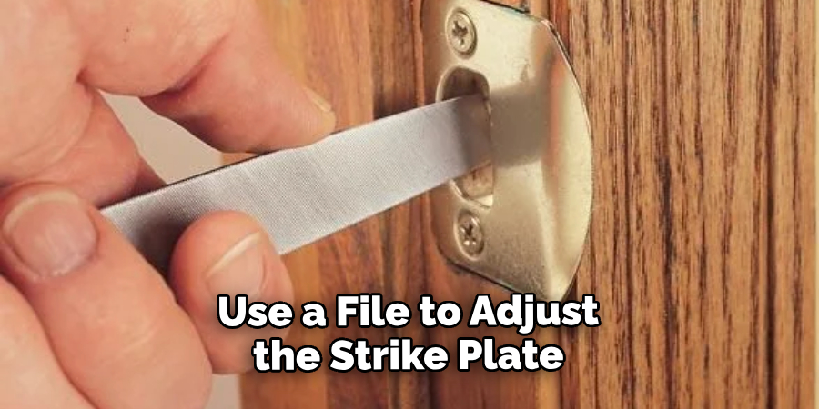 Use a File to Adjust the Strike Plate