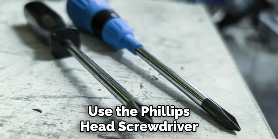 Use the Phillips Head Screwdriver