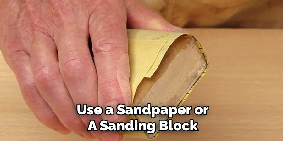 Use a Sandpaper or
A Sanding Block