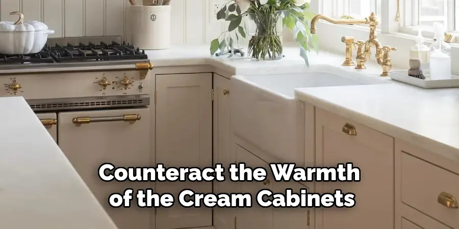 Counteract the Warmth of the Cream Cabinets