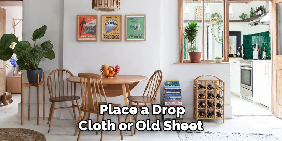 Place a Drop Cloth or Old Sheet