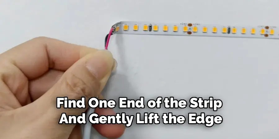 Find One End of the Strip 
And Gently Lift the Edge