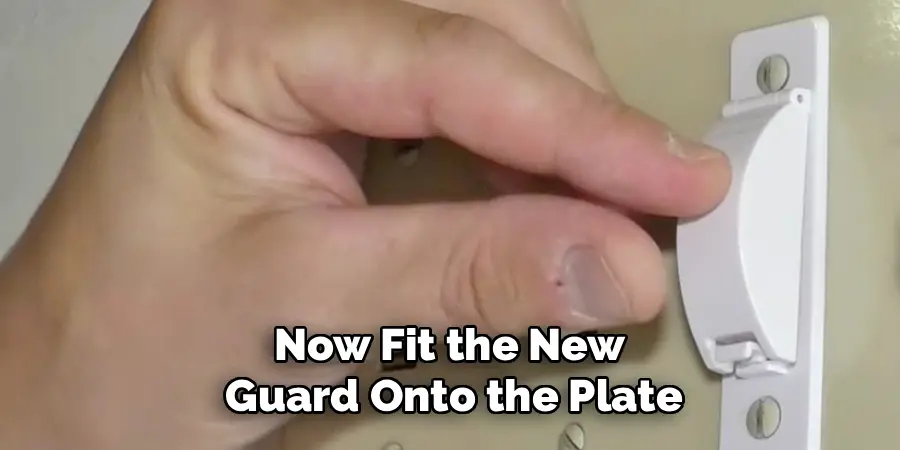 Now fit the new guard onto the plate